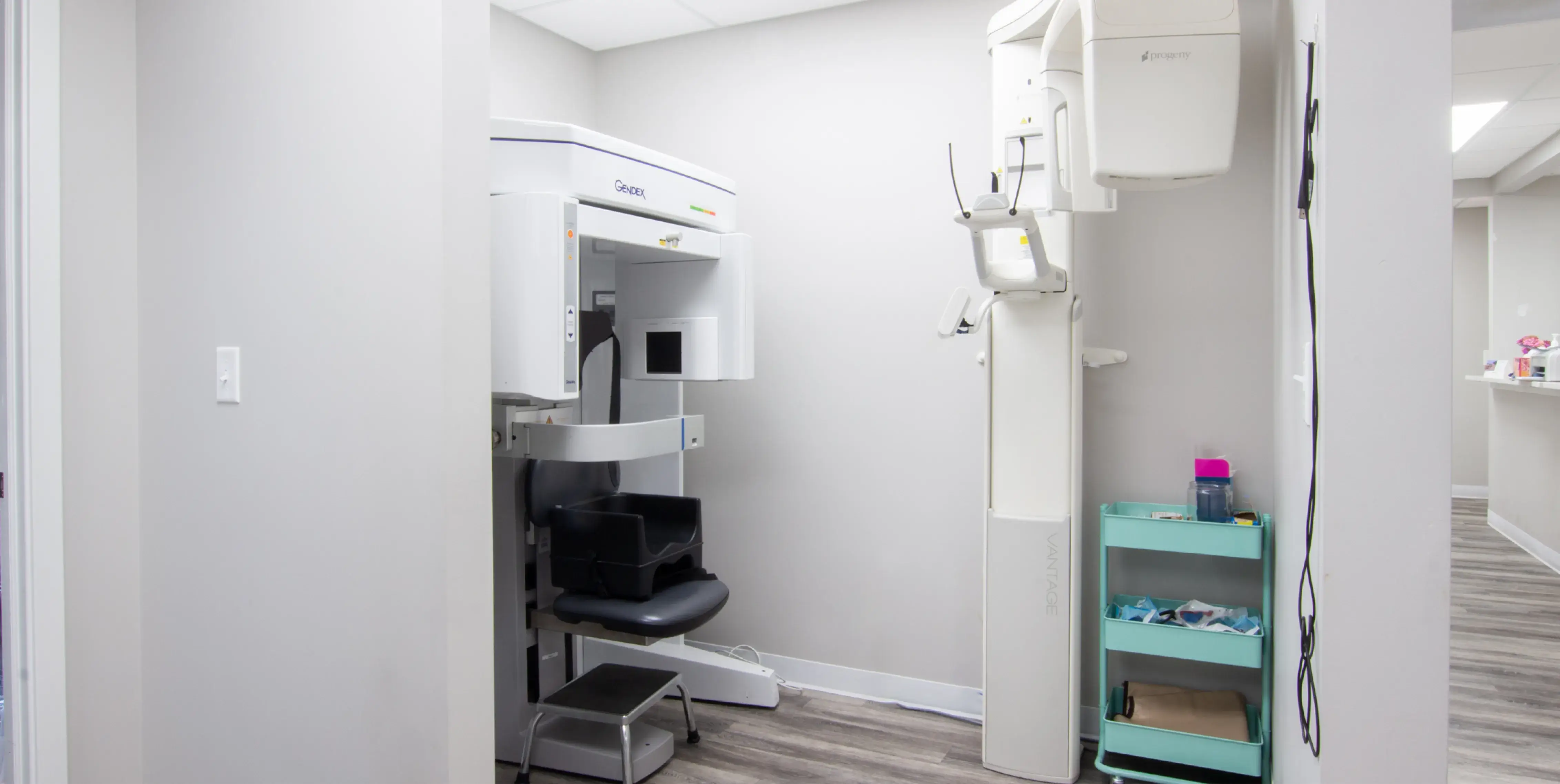a white room with a chair and a shelf